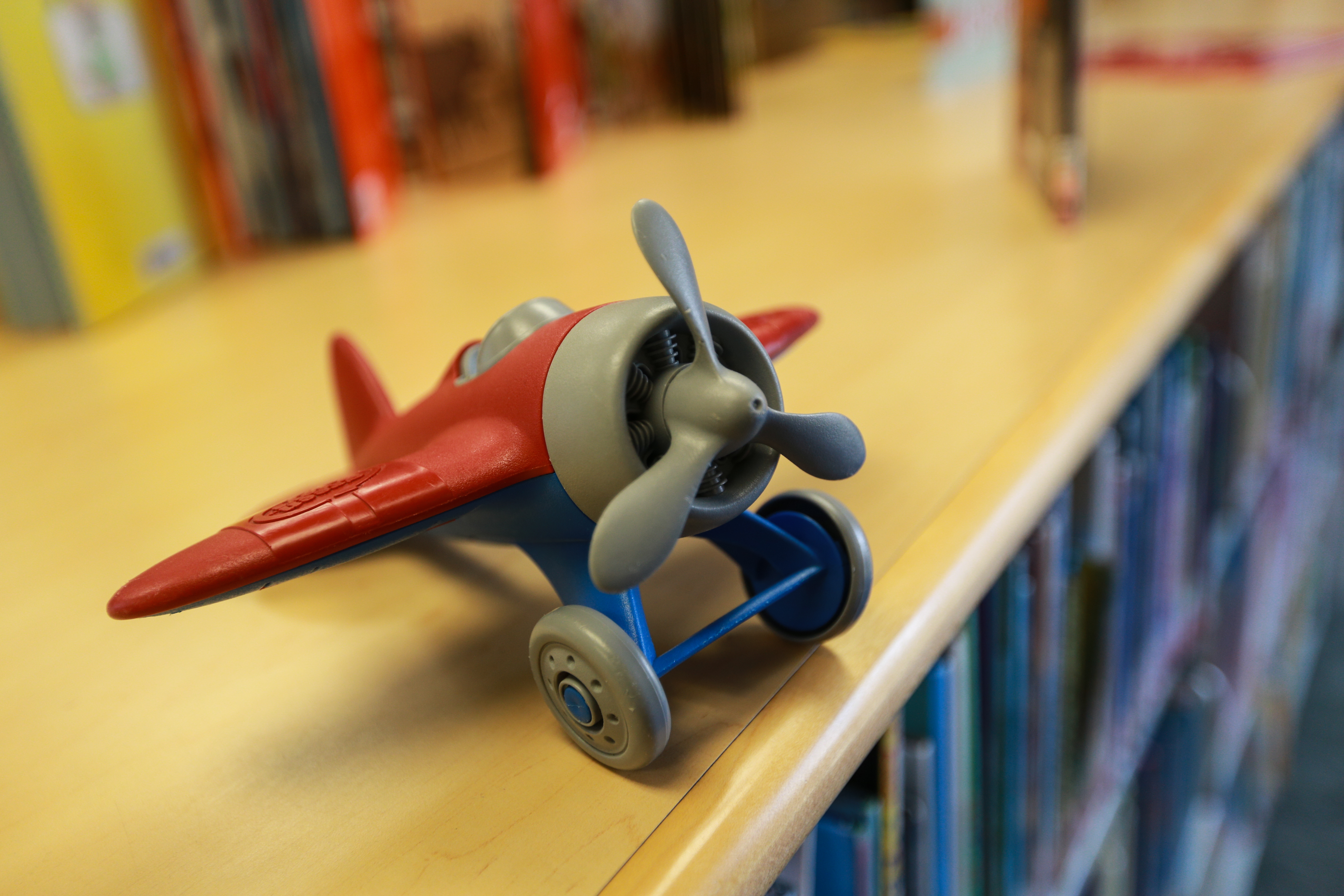 A toy aeroplane on a shelf